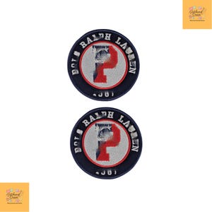 May include: Two circular embroidered patches with the text "POLO RALPH LAUREN" around the edge. The centre design includes a red "P" and a faded image. The patches are navy blue with white and red accents.