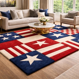 May include: A large area rug with a patriotic design, featuring red, white, and blue squares. The rug incorporates stars and stripes, creating a flag-like pattern. It's placed in a living room setting with furniture.