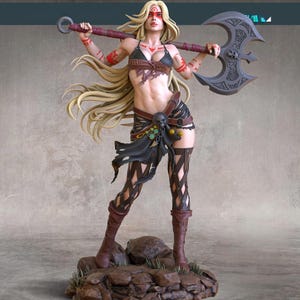May include: A detailed figurine of a female warrior with long blonde hair, red face paint, and tribal tattoos. She wears a leather bikini top, skirt, and boots, and holds a large battle axe with a skull design. The figurine stands on a rocky base.