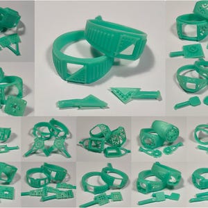 May include: A collection of turquoise-colored jewelry pieces, including rings and other components. The rings feature various geometric and openwork designs. The components appear to be for jewelry making or design, with a focus on intricate details and patterns.