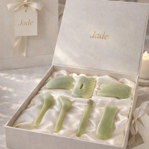 May include: A set of three ceramic mugs with a speckled, matte finish. The mugs are in shades of cream, light gray, and dark gray. Each mug has a simple, minimalist design, perfect for coffee or tea.