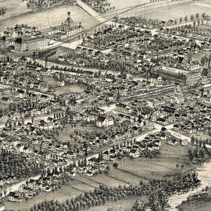 May include: A black and white bird's-eye view illustration of a town featuring numerous houses, industrial buildings, and a winding river. The map includes labeled streets such as Mill St, North St, and Clay St, with railroad tracks visible.