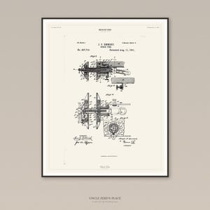 May include: Framed vintage patent print of a bench vise, dated August 11, 1891. The black and white technical drawing shows detailed mechanical components. The print is displayed in a black frame.