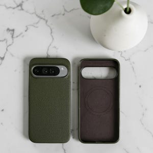 May include: A white ceramic mug with a black handle and the text "But First, Coffee" in a bold, black font. The mug is set against a neutral background, highlighting its simple design.