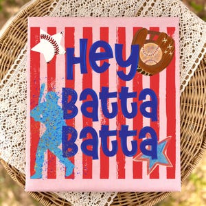 May include: A baseball-themed canvas art piece with a pink background and red vertical stripes. The words "Hey batta batta" are in blue, with baseball and glove illustrations. A baseball-shaped star and a blue star are also included.