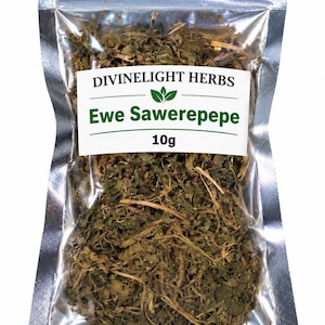 May include: A clear, resealable plastic pouch containing 10g of dried, shredded green herbs. A white label on the front features the text DIVINELIGHT HERBS, a green leaf icon, the name Ewe Sawerepepe in green, and the weight 10g below it.