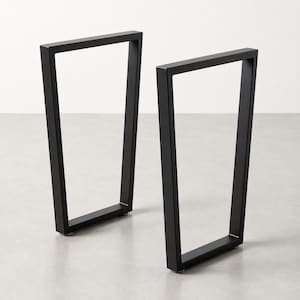 May include: Two black metal table legs with a trapezoidal frame design. Each leg features a rectangular structure that tapers slightly toward the top, constructed from flat metal bars with a smooth, matte black finish and small feet at the base.