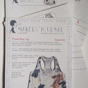 May include: A sewing pattern for a "Truck Stop Top" with a white tank top with a dog print. The pattern is for sizes 6-14 and includes instructions for overlocking, hand sewing, and handling jersey fabrics.