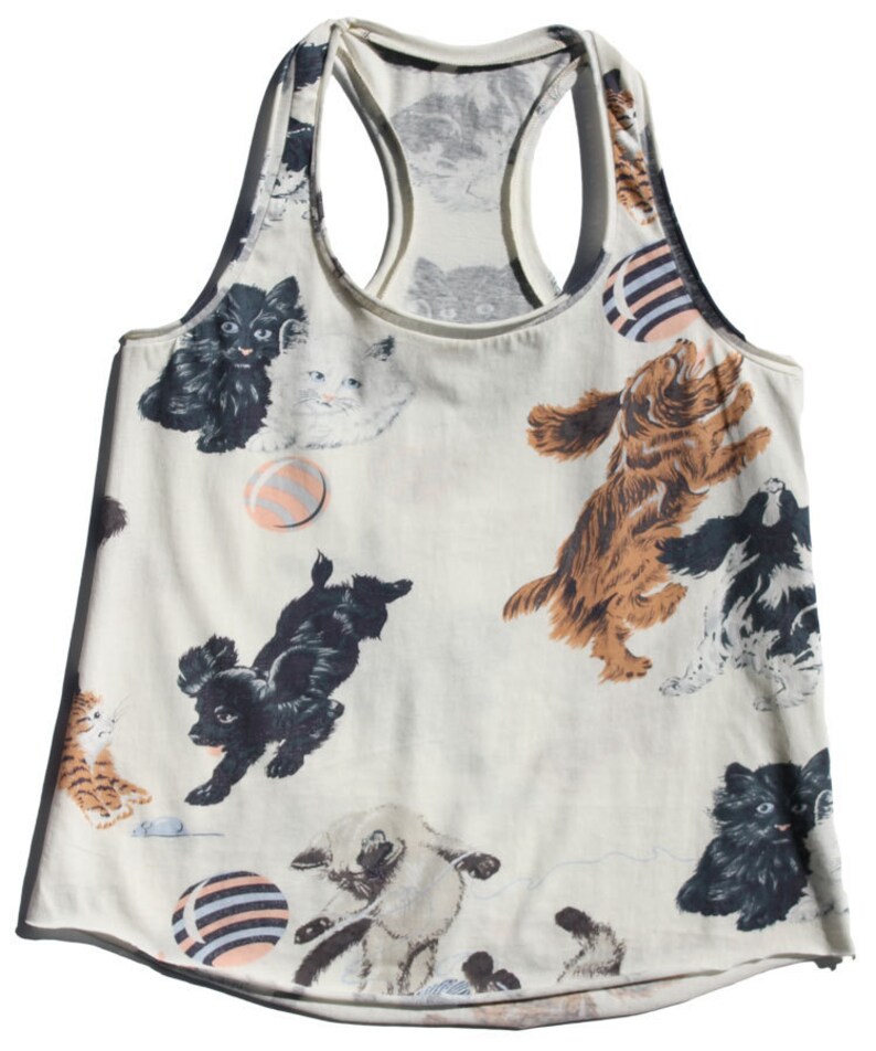 May include: A white tank top with a playful print of cats and dogs playing with balls. The print is in shades of black, brown, white, and gray.