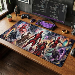 May include: A rectangular desk mouse pad featuring a vibrant illustration of Deadpool in various action poses. The design includes a cityscape backdrop with colorful portal effects and other comic book characters. The pad is on a wooden desk.