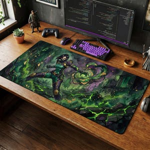 May include: A rectangular gaming mousepad featuring a watercolor illustration of a female character in a green and purple outfit, surrounded by green and gold energy effects. The background depicts a ruined cityscape.