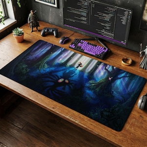 May include: A rectangular mouse pad featuring a fantasy forest scene with a figure in a red cloak. The artwork is predominantly blue and green, with a dark, shadowy creature in the foreground and a bright, illuminated path.