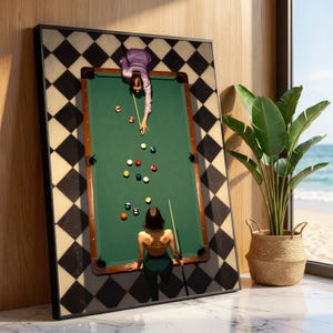 May include: A framed artwork depicting a pool table with two figures playing. The table is green with brown trim, surrounded by black and white checkered border. The figures are dressed in purple and green, with pool balls scattered on the table.