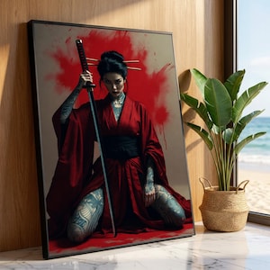 May include: Framed artwork featuring a woman in a red kimono holding a katana. The artwork has a red splash background. The woman has tattoos on her arms and legs. The artwork is displayed near a potted plant and a window with a view of the ocean.