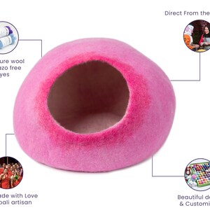 May include: Pink felt cat bed shaped like a dome with a round opening. The bed is handmade by Nepali artisans using 100% pure wool with azo-free dyes. The bed is customizable with different colors and designs.