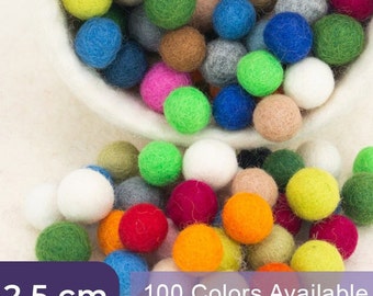 May include: A large bowl filled with colorful felt balls, spilling out onto a white surface. The balls are 2.5 cm in diameter and come in 100 colors.  100 Colors Available.
