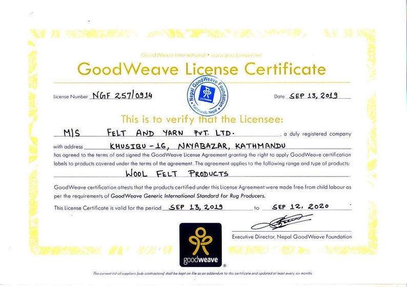 May include: A GoodWeave License Certificate, featuring a gold and white design with text. The certificate verifies Felt and Yarn Pvt. Ltd. as a licensee for wool felt products. The certificate is valid from September 13, 2019, to September 12, 2020.