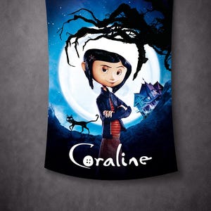 May include: A tapestry featuring the animated character Coraline, standing in front of a full moon. A black cat and a spooky house are also visible. The word "Coraline" is written in white script at the bottom.