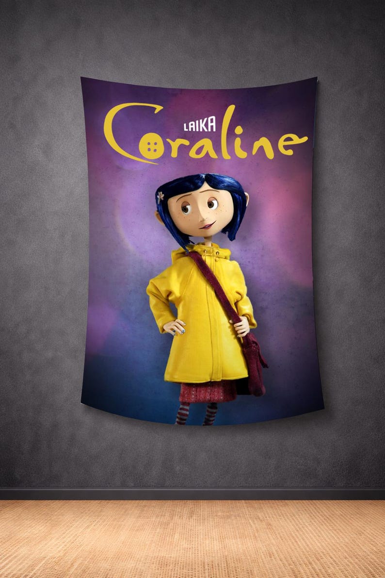 May include: A wall tapestry featuring the animated character Coraline from the movie. The character is wearing a yellow raincoat and carrying a maroon bag. The tapestry has the movie title in yellow script on a purple background.