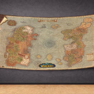 May include: A large, aged map of Azeroth from World of Warcraft, displayed on a dark wall. The map features detailed geographical regions in shades of green, brown, and tan, with the game's logo at the bottom. The map is framed with a brown border.