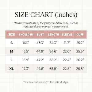 May include: A size chart in inches for a garment, with measurements for shoulder, bust, length, sleeve, and cuff. Sizes range from S to XL. The chart includes the text: "This is an oversized/relaxed fit design."