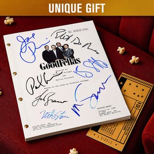 May include: A white script with the title "GoodFellas" and multiple signatures in blue and black ink. The script is on a red surface with popcorn and a vintage movie ticket. The text "UNIQUE GIFT" is at the top.