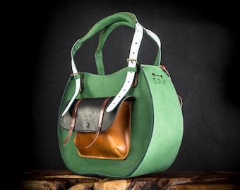 Green vintage style zippered leather purse with big pocket outside and handstitched straps made in ladybuq art