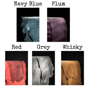 May include: Six leather swatches in different colors: navy blue, plum, red, grey, and whiskey. The swatches are folded and arranged in a grid.