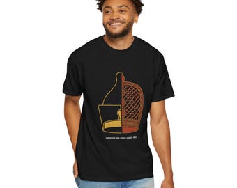 May include: A black short-sleeve t-shirt featuring a split graphic design. The left side shows a gold-colored crown outline, while the right side displays a red and orange patterned headpiece. Below the graphic is the text TWO RIVERS, ONE LEGACY (NIGER + NILE).