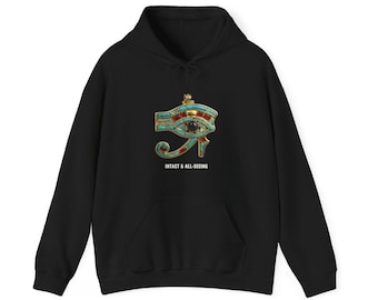 May include: A black hooded sweatshirt featuring a graphic of the Eye of Horus in gold, turquoise, and red tones. Below the graphic, the text reads INTACT & ALL-SEEING in white capital letters. The hoodie includes a front kangaroo pocket and drawstrings.