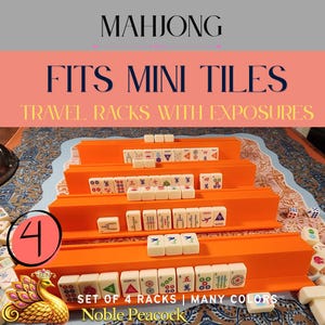 May include: A set of four bright orange plastic Mahjong racks designed for mini tiles, featuring horizontal ledges for tile placement. The racks are arranged in a tiered formation, displaying various white Mahjong tiles with colorful symbols and characters.