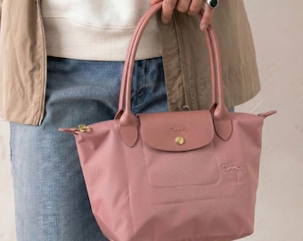 Bolso tote grande de nailon Longchamp color rosa empolvado vintage, bolso de viaje ligero y plegable.