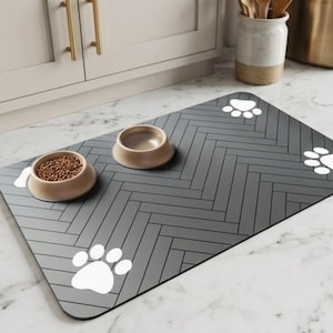 May include: A handmade wooden sign with the text "Welcome" in a playful font. The sign is painted white with a distressed finish, and features a decorative floral design in shades of pink and green. It is designed for indoor or outdoor use.