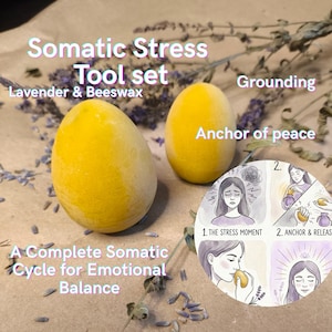 May include: A somatic stress tool set with two yellow, egg-shaped objects. The text on the image reads "Somatic Stress Tool set, Lavender & Beeswax, Grounding, Anchor of peace, A Complete Somatic Cycle for Emotional Balance."