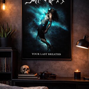 May include: A framed poster featuring the band "Suffocation" in white, stylized text. The artwork depicts a figure against a blue and black cosmic backdrop, with the text "YOUR LAST BREATHS" below. The poster is displayed on a dark wall.