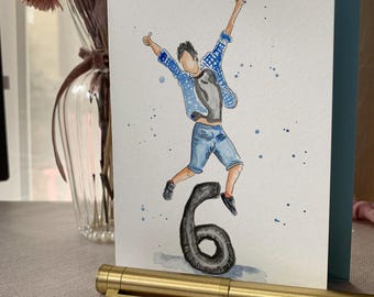 May include: A greetings card featuring a watercolour illustration of a person jumping over a large black number six. The person wears a blue plaid shirt, a dark grey t-shirt, and blue denim shorts. Blue paint splatters decorate the white background.