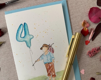 May include: A watercolour greeting card featuring a child in a brown hat, blue shirt, and brown trousers holding a large blue balloon shaped like the number 4. The illustration includes a green grassy base and yellow speckles on a white background.