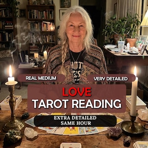 May include: A woman with long gray hair smiles, seated at a wooden table with tarot cards. The words "LOVE TAROT READING" are displayed. Lit candles and crystals are on the table. Text reads "REAL MEDIUM", "VERY DETAILED", and "EXTRA DETAILED SAME HOUR".