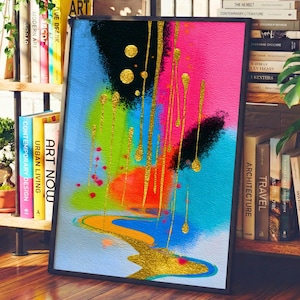 May include: Abstract art print with a black frame. The artwork features a vibrant mix of colors, including blue, pink, green, and orange, with gold metallic accents. The design includes paint drips and splatters, creating a dynamic and modern aesthetic.