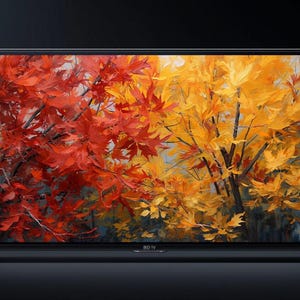 以下が含まれることがあります： フラットスクリーンのテレビは、秋の葉の鮮やかな絵を表示しています。アートワークは赤と黄色の葉を特徴とし、暖かく魅力的なシーンを作り出しています。テレビは黒いフレームで、2つの小さな脚の上に立っています。