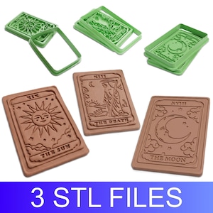 May include: Three rectangular cookie cutters in light green plastic and three corresponding brown embossed cookie impressions featuring tarot card designs of The Sun, The Death, and The Moon with text. The image includes the text 3 STL FILES.