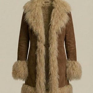 May include: A brown suede coat with a beige faux fur collar, cuffs, and trim. The long coat has a tailored fit and a classic design, perfect for cold weather. The coat is a medium length.