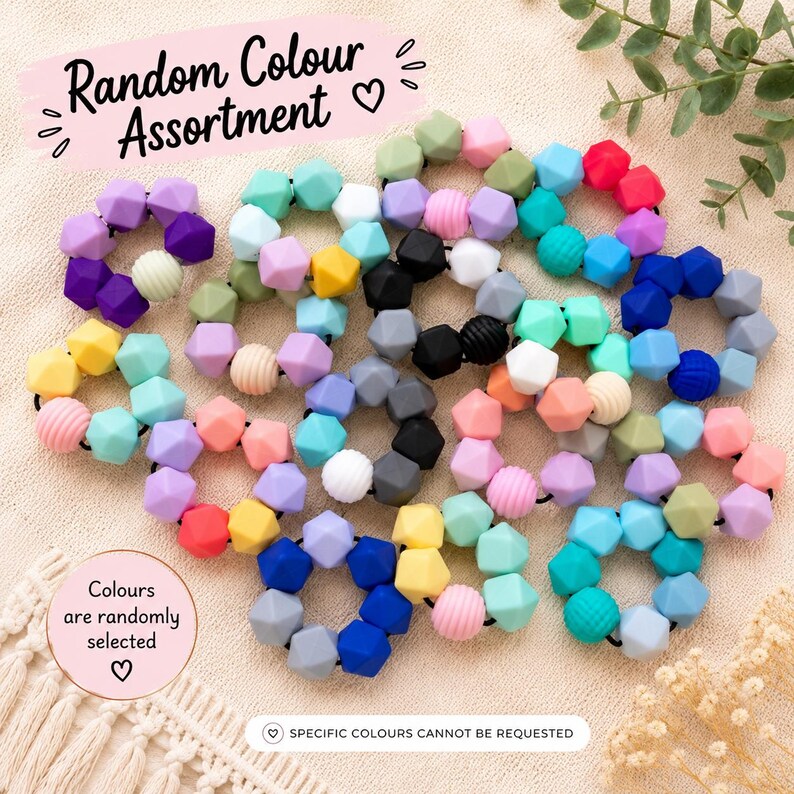 May include: A collection of circular hair ties made from multi-coloured silicone beads in various geometric shapes and textures. The text Random Colour Assortment, Colours are randomly selected, and SPECIFIC COLOURS CANNOT BE REQUESTED is visible.