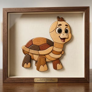 May include: A framed wooden wall art piece featuring a multi-toned turtle made of various wood grains. The turtle has a smiling expression and large eyes. A brass plaque at the bottom reads: TURTLE FRIENDS - HANDCRAFTED WOOD INTARSIA - 2024.