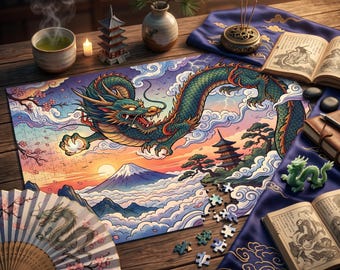 May include: A jigsaw puzzle featuring a green dragon flying over a mountain landscape with clouds, a pagoda, and a sunset. The scene includes a folding fan, an open book, a small incense burner, a tea cup, and loose puzzle pieces on a wooden table.