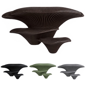 May include: A large, dark brown, three-tiered mushroom-shaped wall shelf with a textured, ribbed underside. Below, three smaller versions of the same shelf are displayed in solid black, muted olive green, and charcoal grey colour variations.