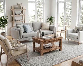 May include: A living room set featuring a light gray sofa with blue and beige throw pillows, a wooden coffee table with a lower shelf, a cream-colored armchair with a wooden frame, a white armchair, a wooden bookshelf, and a gray area rug.