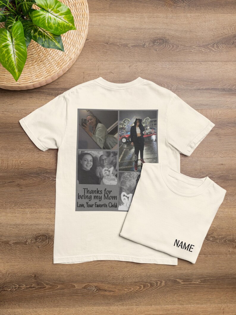 May include: Off-white t-shirt with a collage of black and white photos and the text "Thanks for being my Mom Love, Your Favorite Child." A second folded t-shirt is next to it with the word "NAME" printed on it.