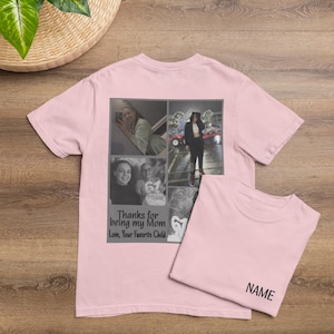 May include: A light pink t-shirt with a collage of photos and the text "Thanks for being my Mom Love, Your Favorite Child." A second t-shirt is folded next to it with the word "NAME" printed on it.