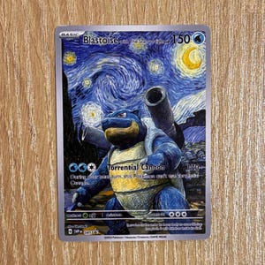 May include: A Pokémon trading card featuring Blastoise with a starry night background. The card has a blue and silver color scheme, with the text "Blastoise with The Starry Night" at the top. The card also includes the text "Torrential Cannon".